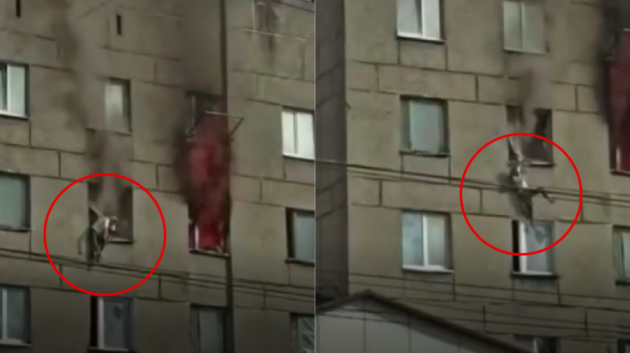 STOP CADRU Momentul în care o femeie sare dintr-un apartament în flăcări situat la etajul patru