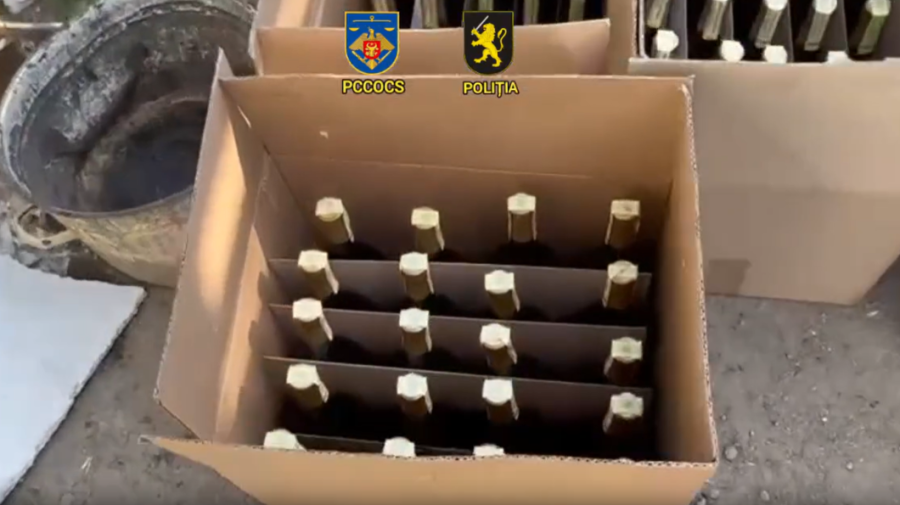 VIDEO Afacere ilegală cu alcool, destructurată la Chișinău: Sute de sticle e divin, ridicate de poliție