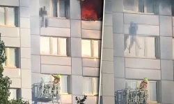 Momentul dramatic în care o femeie sare de la etajul 11, în braţele pompierului, pentru a scăpa de incendiu