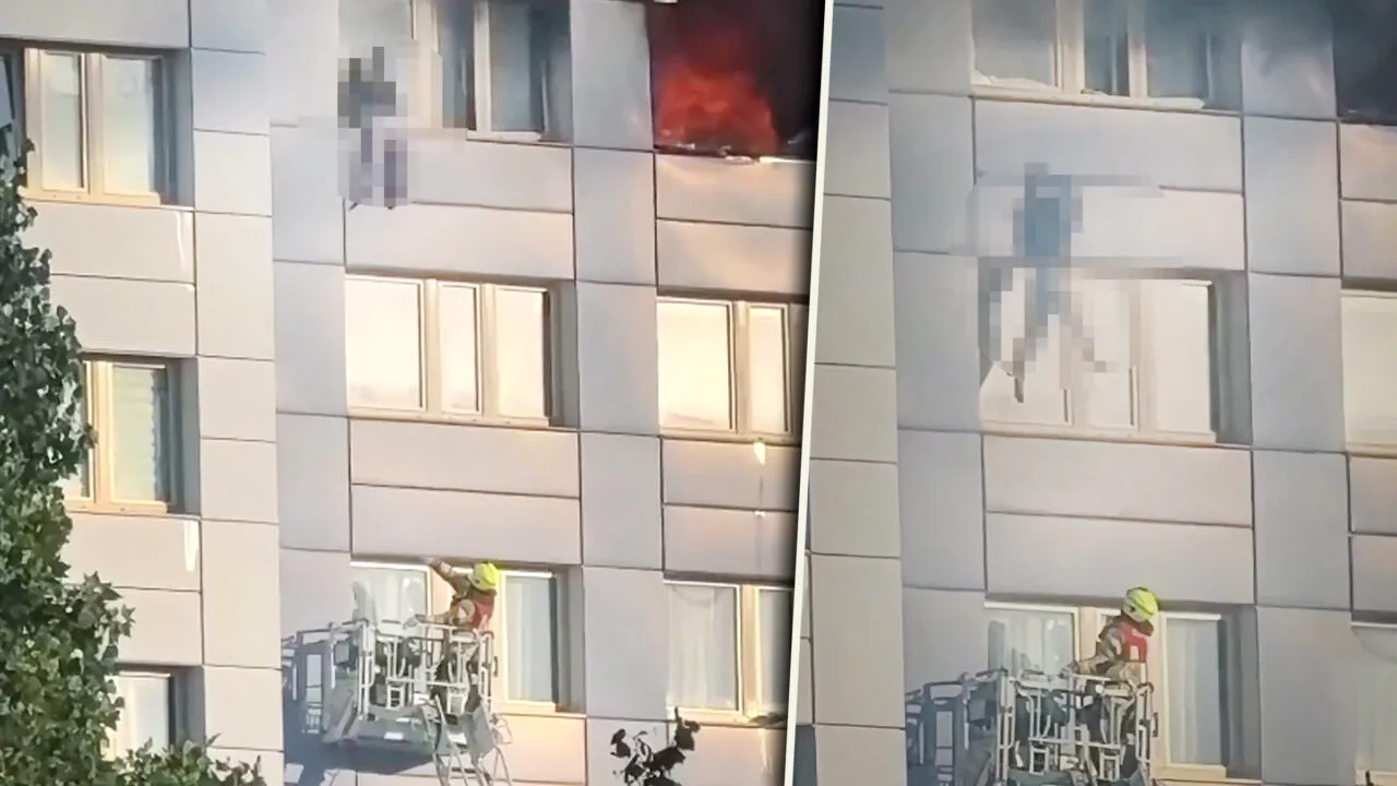 Momentul dramatic în care o femeie sare de la etajul 11, în braţele pompierului, pentru a scăpa de incendiu
